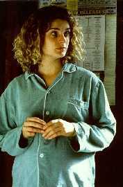 Feeling overdressed, Danielle contemplates ripping off one
more button.