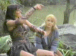 Gabrielle tries not to look too bored by another of Xena's fishing tales
